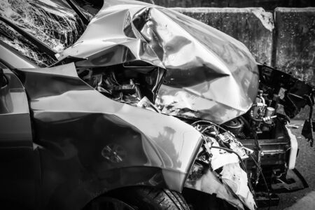 Blue car suffered an accident in front of a car damaged on a road in Bangkok, Thailandの写真素材