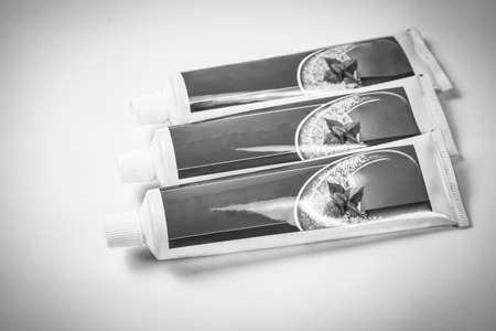 Three tubes of toothpaste isolated on white, Backgroundsの写真素材