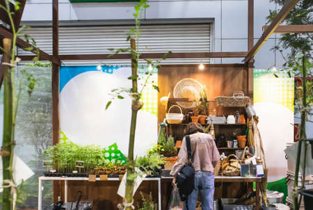 Woman in a vegetable booth in Home and Garden Exhibition 2020 Show at BITEC Bangna, Bangna-Trad road...