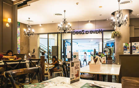 Foggy cleaning spray in baskets on marble tables in restaurants in Shopping Mall at Sukhumvit road Bangkok Thailand, March 26, 2021のeditorial素材