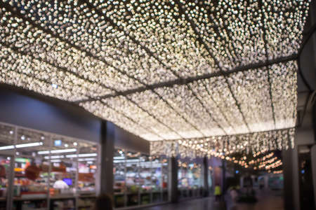 Blurred, The corridor in front of Supermarket with decorative lights in Community Mall, Bangkokの写真素材