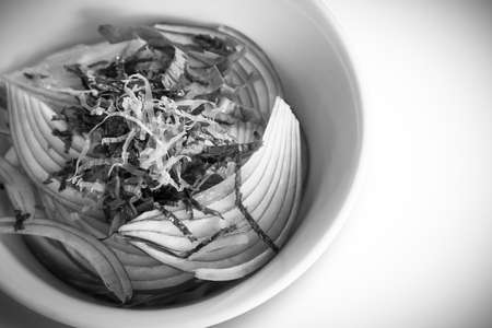 Homemade salad, Red onion topping with line fish, line seaweed and green leafy vegetables, Healthy...