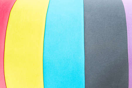 Colors of red yellow blue black and pink fabric background