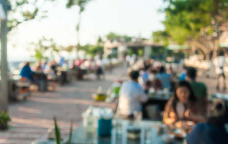 Blurred, People eating and drinking in open air restaurant Samut Prakan Thailand