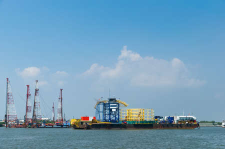 The container cargo ship is being renovated in a dock on the Chao Phraya River at Bang Pu...