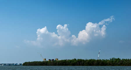 Clouds and blue sky over the Chao Phraya River Samut Prakan, Thailandの写真素材