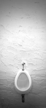 Single male urinal on cement wall, Object backgroundの写真素材