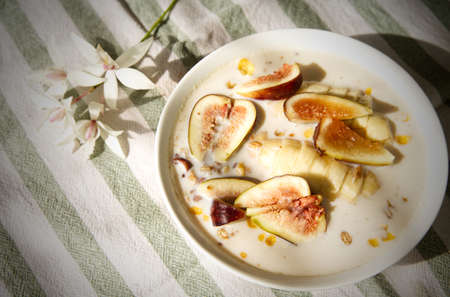 A cereal with bananas and figs in soy milk is a great breakfast treat, healthy eating background