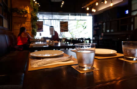 Glass of drinking water on a table in a restaurant in Bangkok Thailand