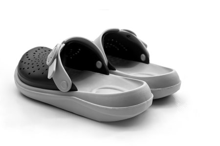 Black and pink slippers isolated on white backgroundの写真素材