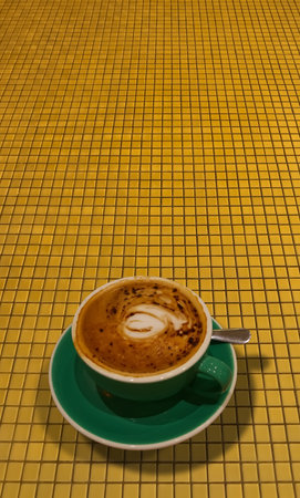 Hot coffee in green cup isolated on backgroundの写真素材