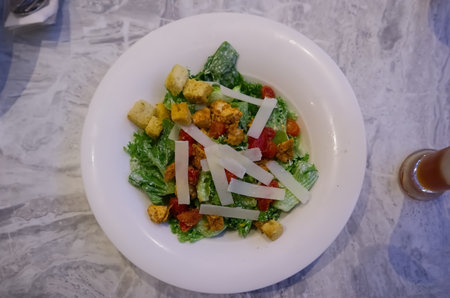 Salad on white plate on the table, healthy food backgroundの写真素材