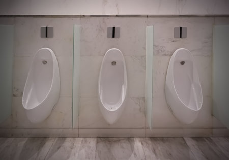 The clean male urinals in the restroom in the shopping mall, Public toilets backgroundの写真素材