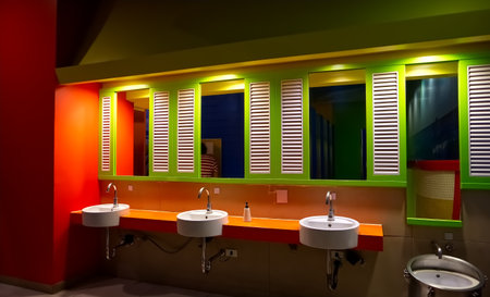 Orange and green men's restroom in a shopping mall, Bangkok, Thailandの写真素材