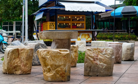 Set of stone tables and chairs in a gas station at Lop Buri Thailand