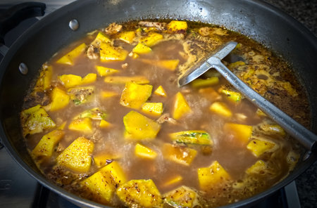Pork and pumpkin stewed with curry in a pan, food backgroundの写真素材