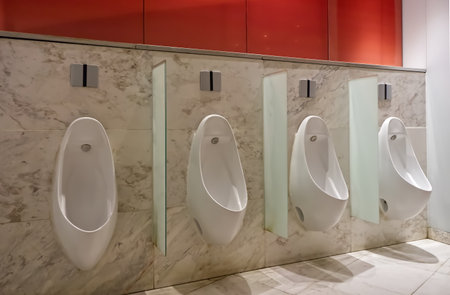 Men's urinals in a men's restroom in a shopping mall Bangkok Thailandの写真素材