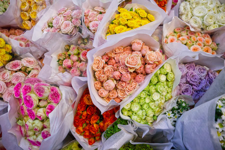 Group of rose bouquets wrapped in paper, natural pattern background