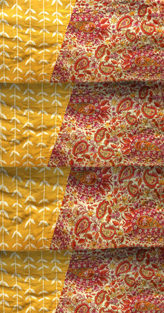 Yellow and red fabric patterns sewn together, pattern background