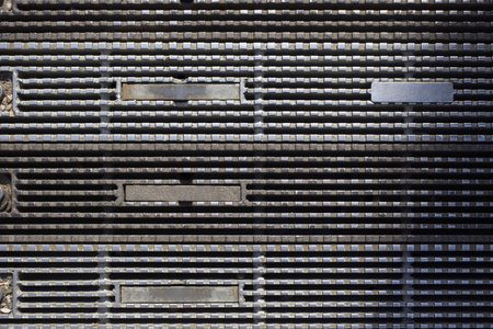 Steel grating drain cover pattern backgroundの写真素材