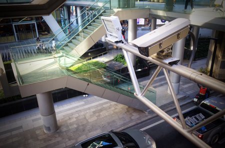 CCTV cameras with LED lights for nighttime illumination at Ratchaprasong Intersection, Bangkok, Thailandの写真素材