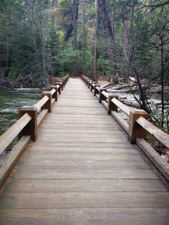 Wooden bridge cross a riverの写真素材