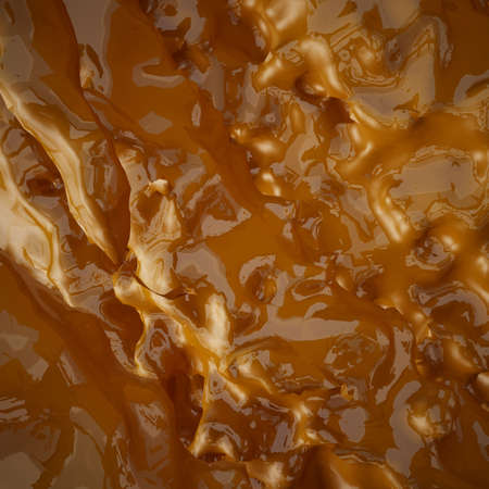 Flowing liquid smooth golden backgroundの写真素材
