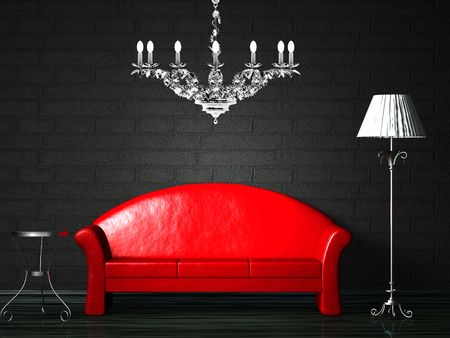 Red couch with table, standard lamp and luxury chandelierの写真素材