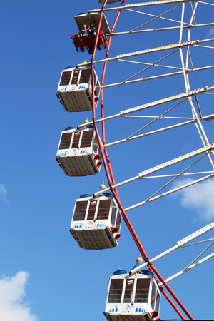 Large Ferris wheel's cabins on the blue skyのeditorial素材