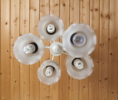 Close-up of a white chandelier with eco bulb