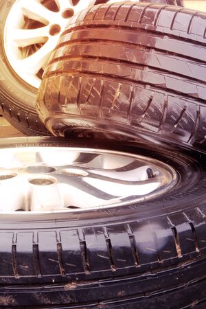 close up view of stack car disks with tyres