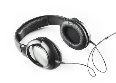 Music grey headphones with cable isolated on a white backgroundの写真素材