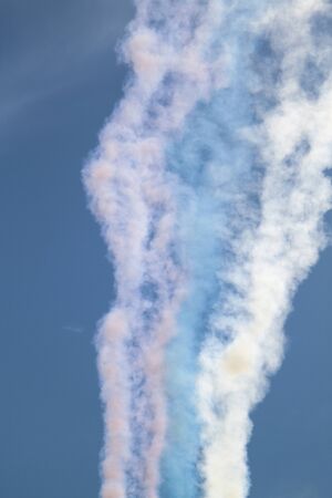 trail from the aircraft in the sky in the colors of the Russian flagの写真素材