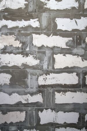 Background texture of wall from white lightweight foamed brick with cement adhesive