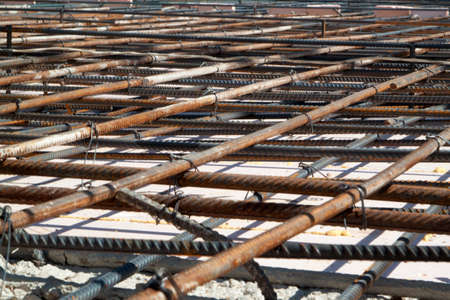 view of reinforcement of concrete with metal rods connected by wire. Preparation for pouring the...