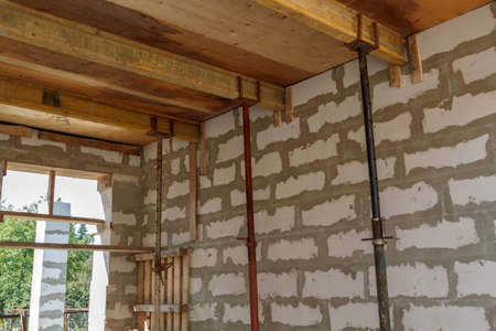 view of the wooden formwork with metal holders, which will be filled with the overlap between the...