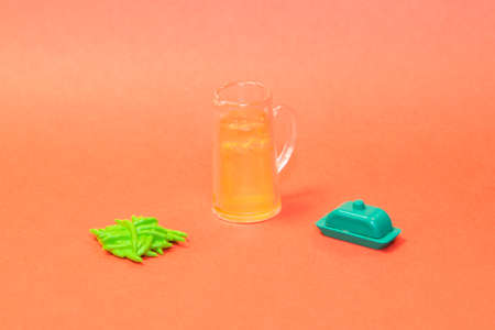 fresh lemonade with decoration on pastel orange background