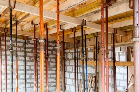view of wooden formwork with metallic holders, which will be filled with overlap between floors in...