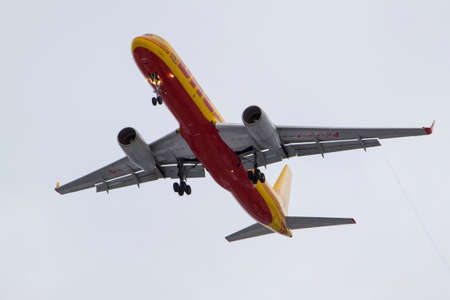 Moscow region, Russia - November 2, 2019: Close up view of yellow cargo airplane Tupolev Tu-204C DHL...