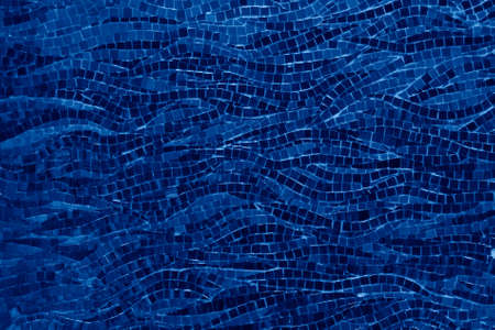 Close up of small mosaic tiles for background toned in trendy Classic Blue color of the Year 2020の写真素材