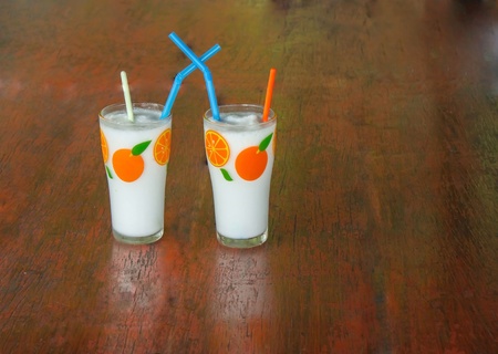 Spinning cool coconut water at the beach の写真素材