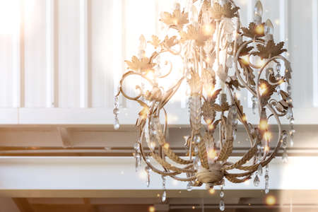 close up chandeliers in cream white color, decorated with leaves and crystal beads. Hanging inside the coffee shop the light creates an atmosphere. Feel relaxed Interior decorating ideasの写真素材
