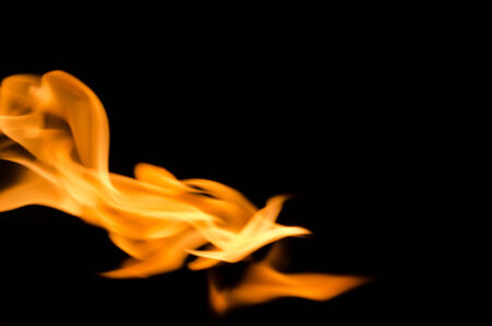 Fire flames on a black backgroundの写真素材