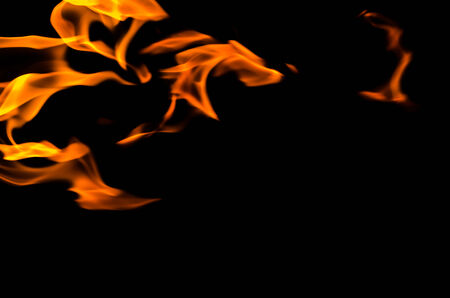 Fire flames on a black backgroundの写真素材