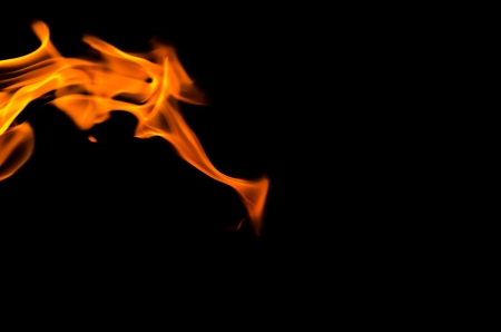 Fire flames on a black backgroundの写真素材