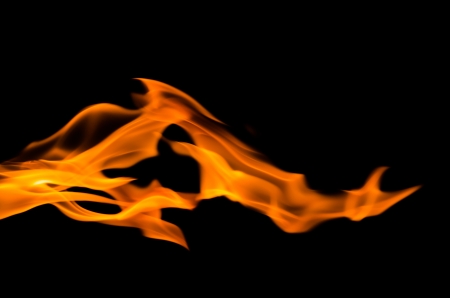 Fire flames on a black backgroundの写真素材