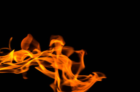 Fire flames on a black backgroundの写真素材