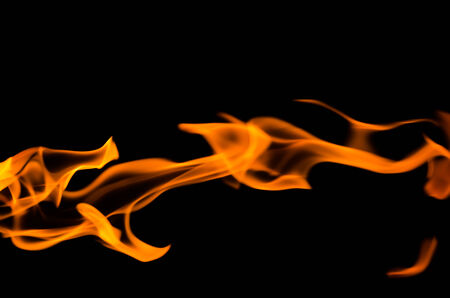 Fire flames on a black backgroundの写真素材