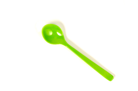 Colorful plastic ice cream spoons on a white background.の写真素材
