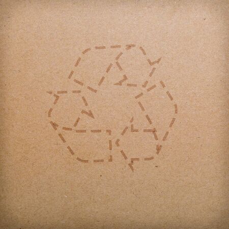 recycle logo on recycled paper backgroundの写真素材